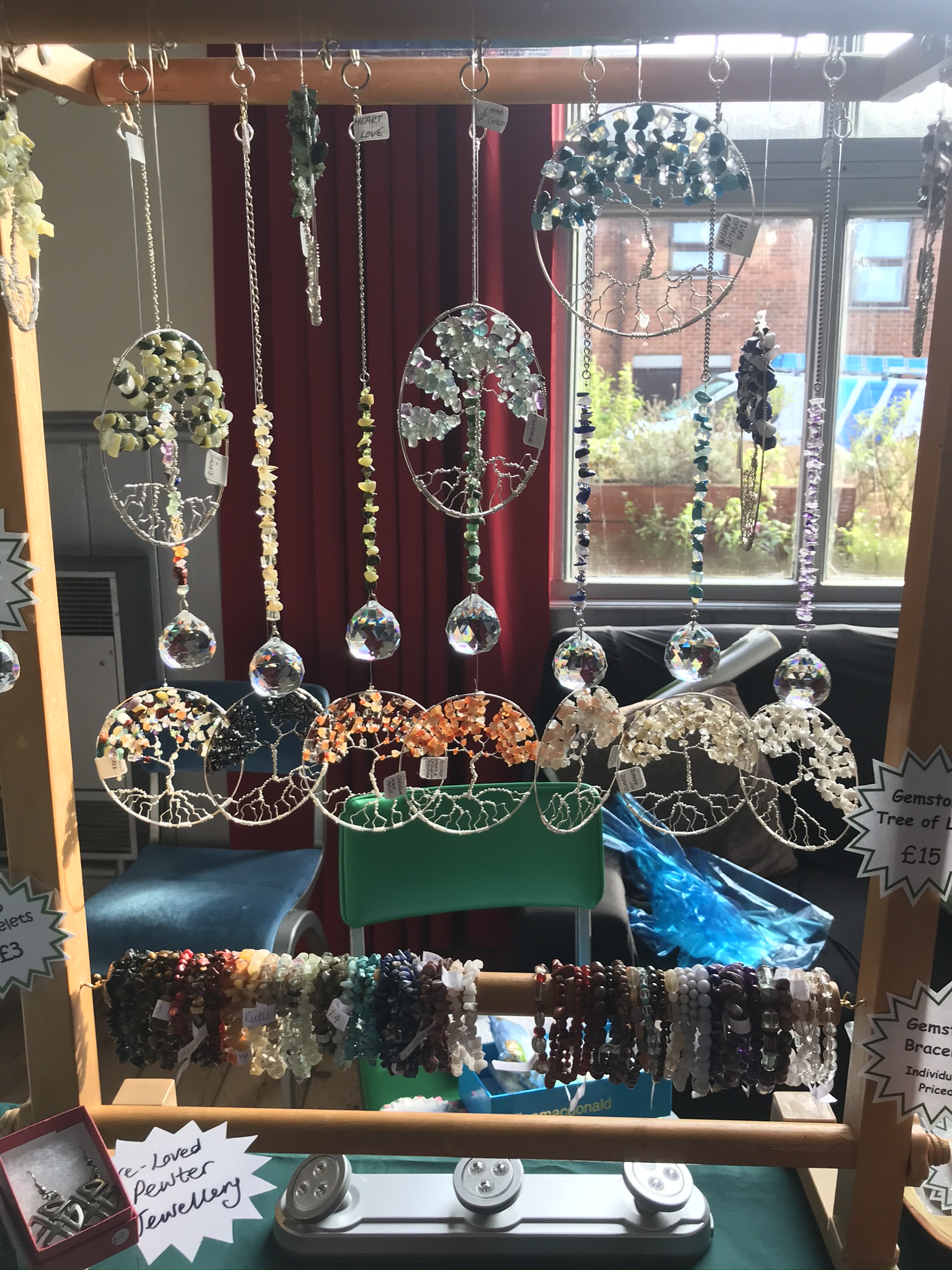 Gemstone bracelets and tree of life hangers.