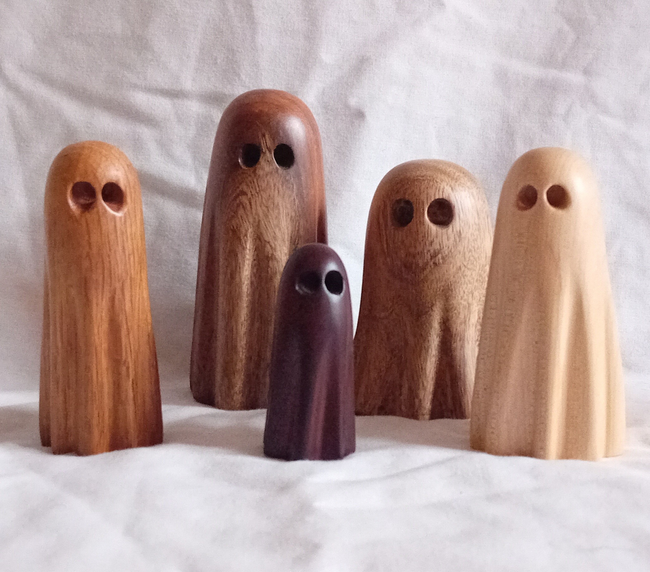 Five hand-carved wooden ghosts. Picture by Gemma and Mychael Pash.