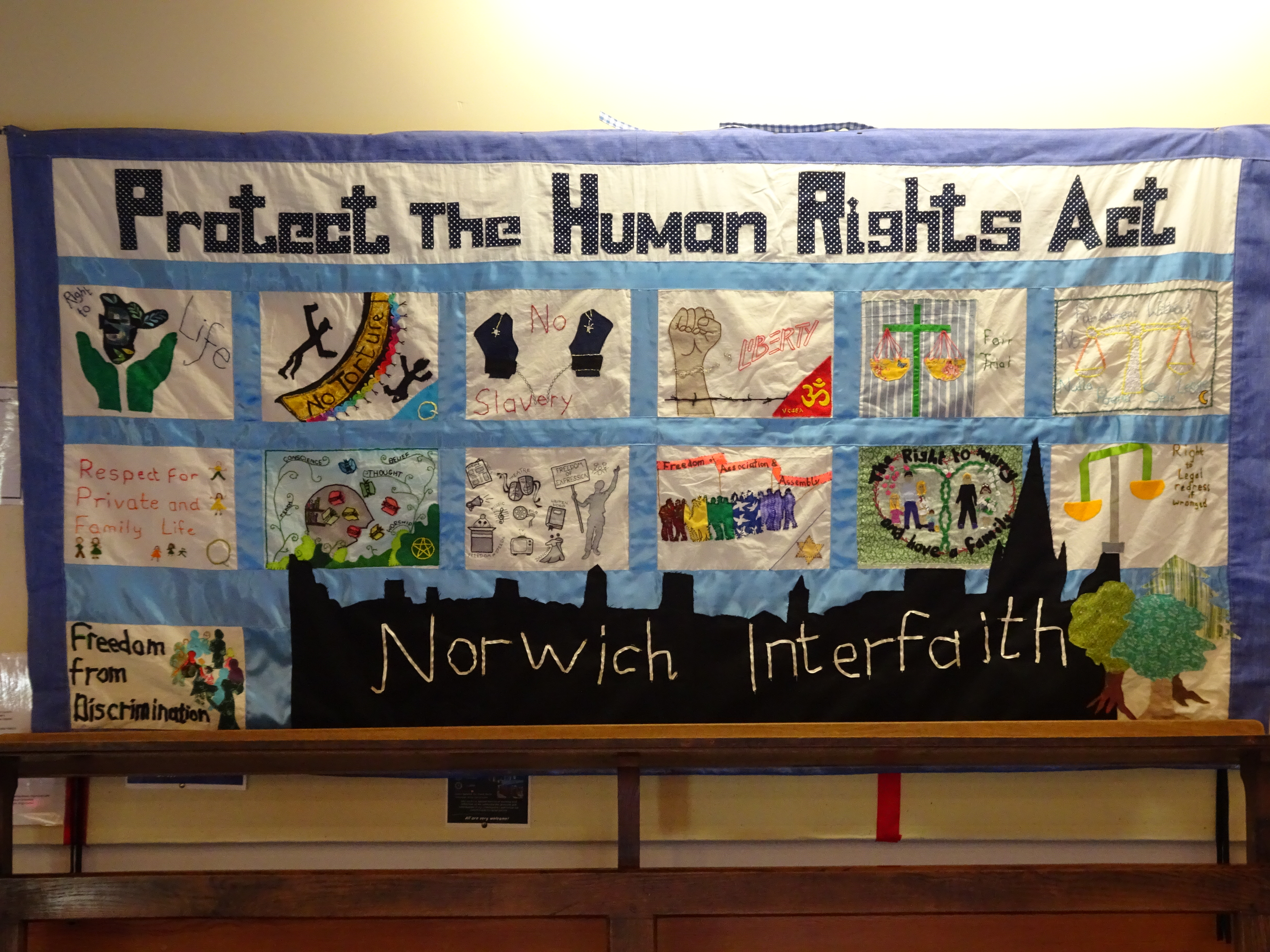Quilt with panels for the 13 articles of the European Convention on Human Rights, with a title,