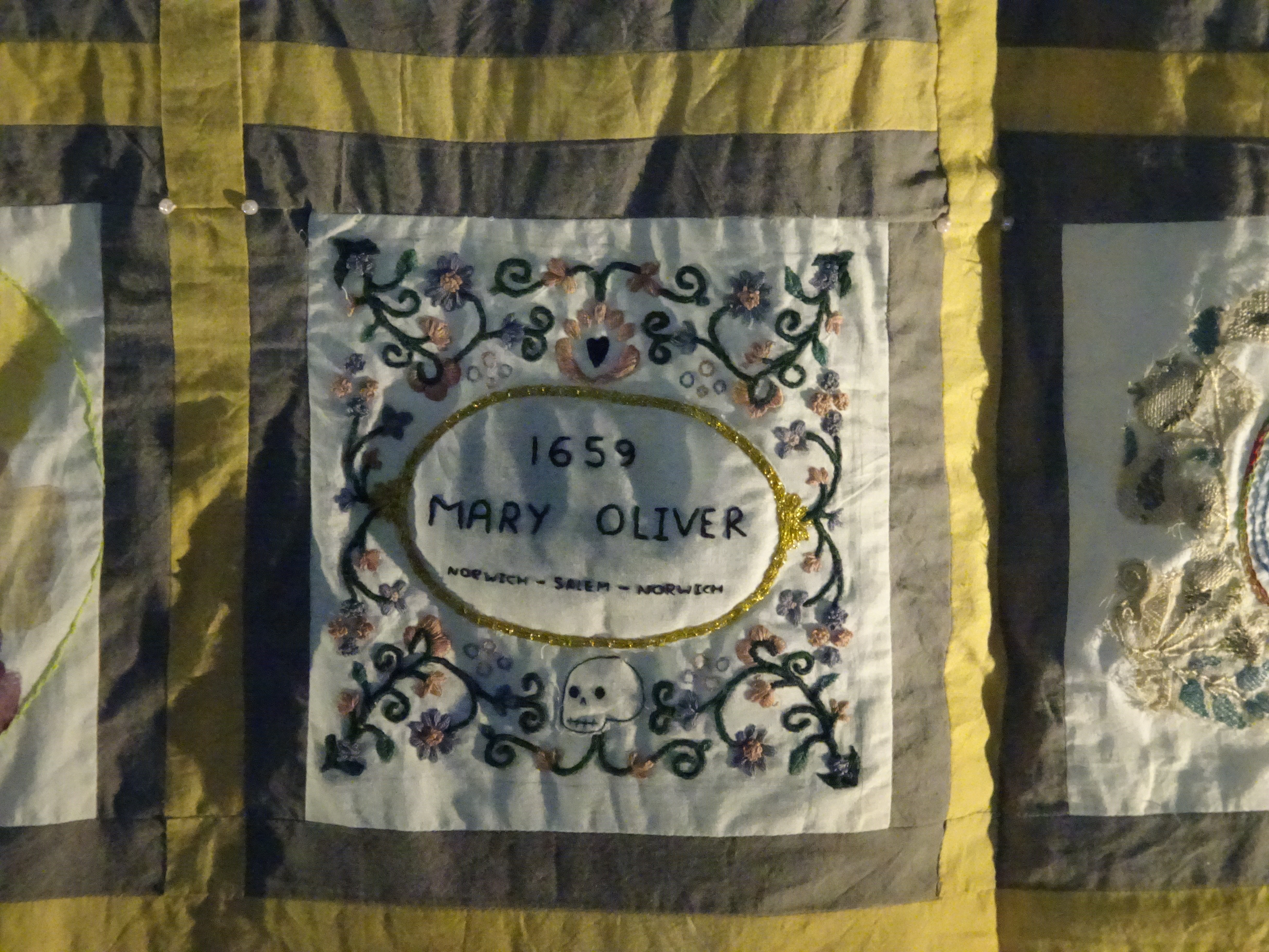 Quilt panel by Siofra Connor showing a cartouche bearing Mary Oliver's name, the year 1659 and the places